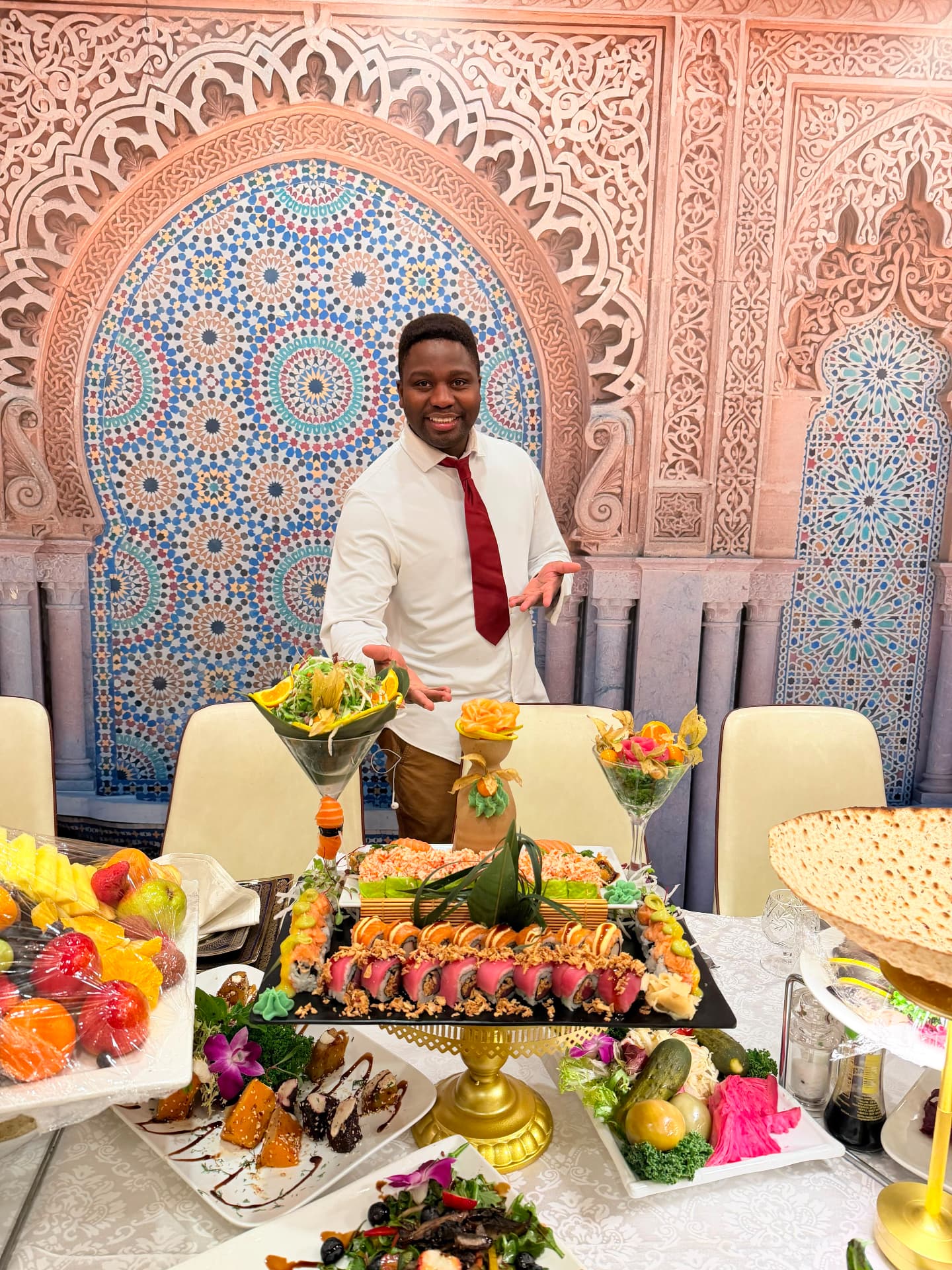 Chef Momo presenting a private omakase spread