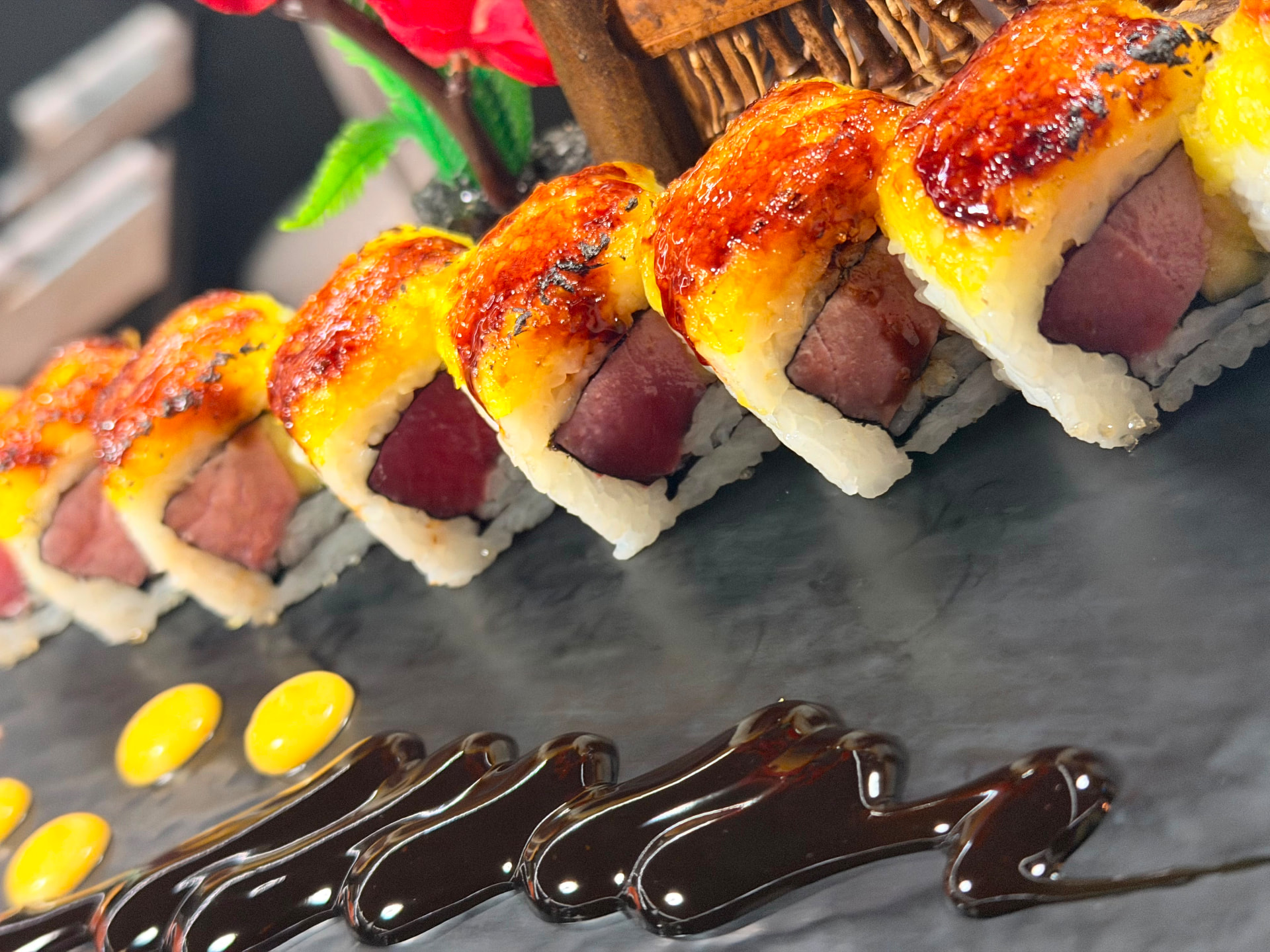 Torched aburi tuna rolls with sauce detail