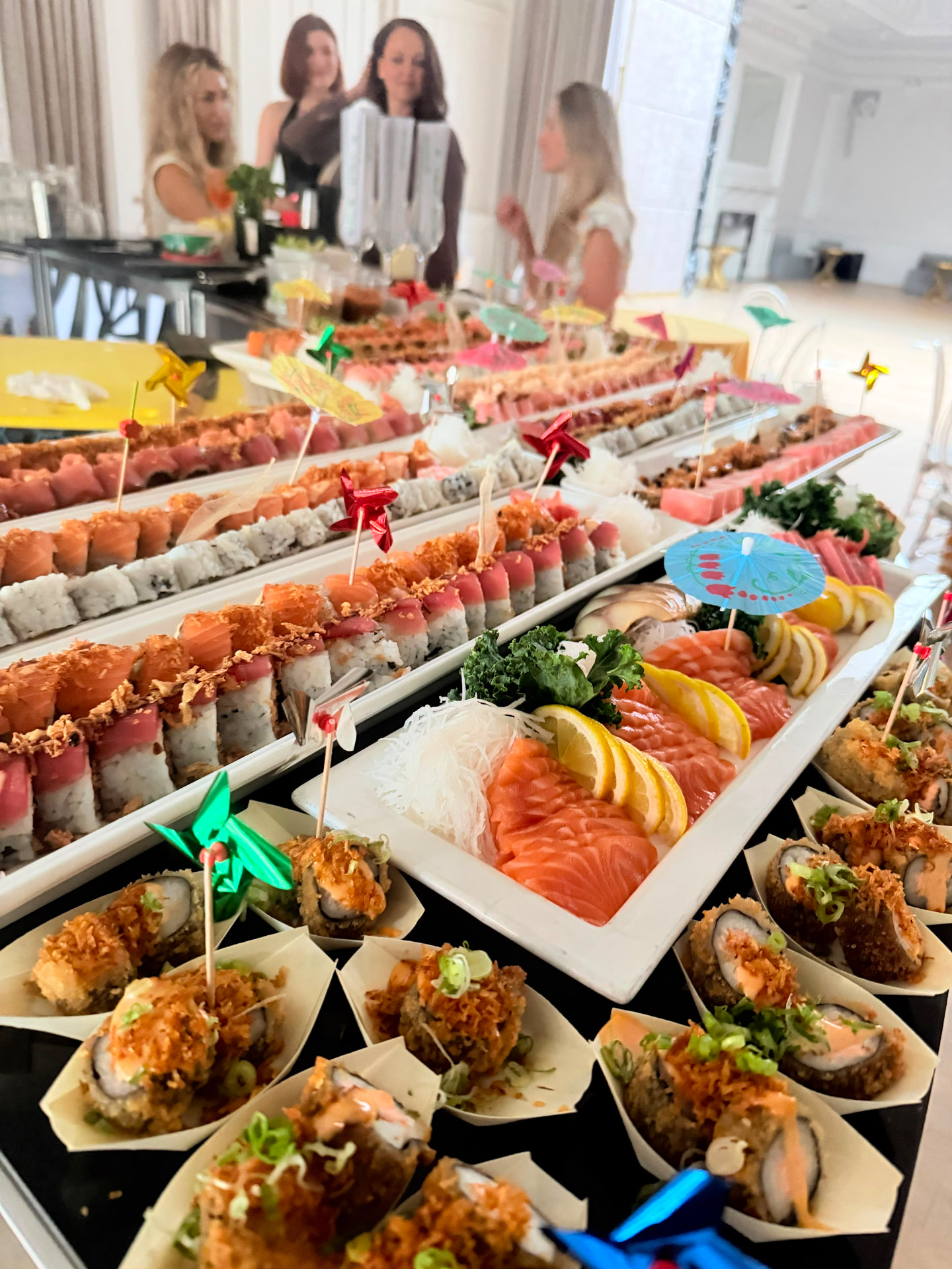 Long sushi buffet set up at a private event